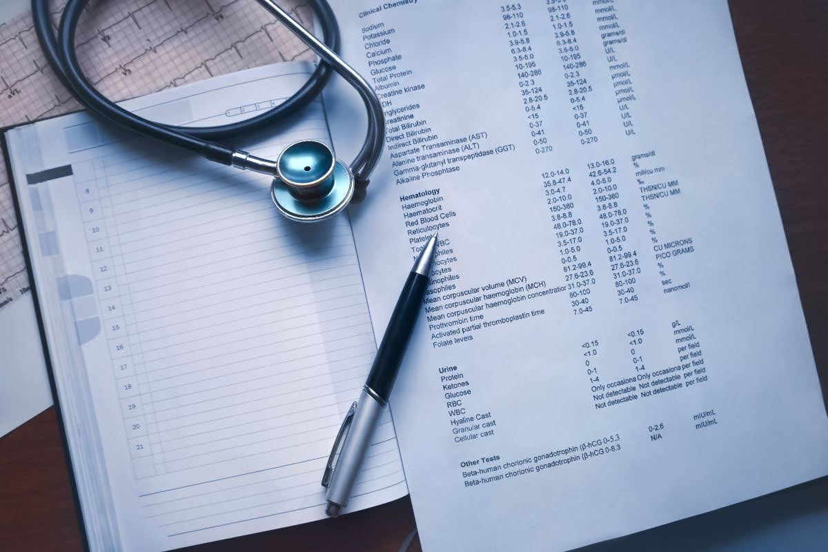 Paperwork with pen and stethoscope